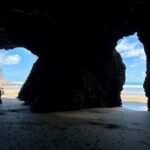 Auckland Natural Caves and Tunnels Private VIP Tour - Bethells Beach: Seaside Serenity and Coastal Drama