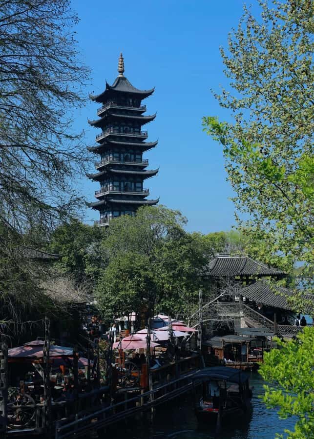 From Suzhou: Wuzhen Water Town Tour with Riverside Essence - FAQs