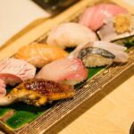 Osaka: Guided Food Tour with 12 Dishes at 4 Local Eateries - Visiting Local Eateries and Sake Bars