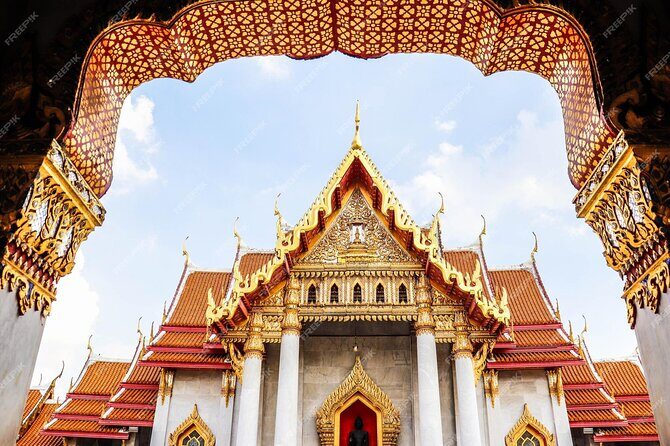 Bangkok Heritage and Shopping Excursion with Guide - Visiting Wat Phra Kaew and the Grand Palace