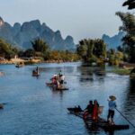 From Yangshuo: Yulong River bamboo raft Ruyi Peak Day Tour - Exploring the Itinerary in Detail