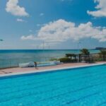 Okinawa: Sunset Beach Walk and Swim with Dinner - Swimming in Style: Pool & Ocean Options