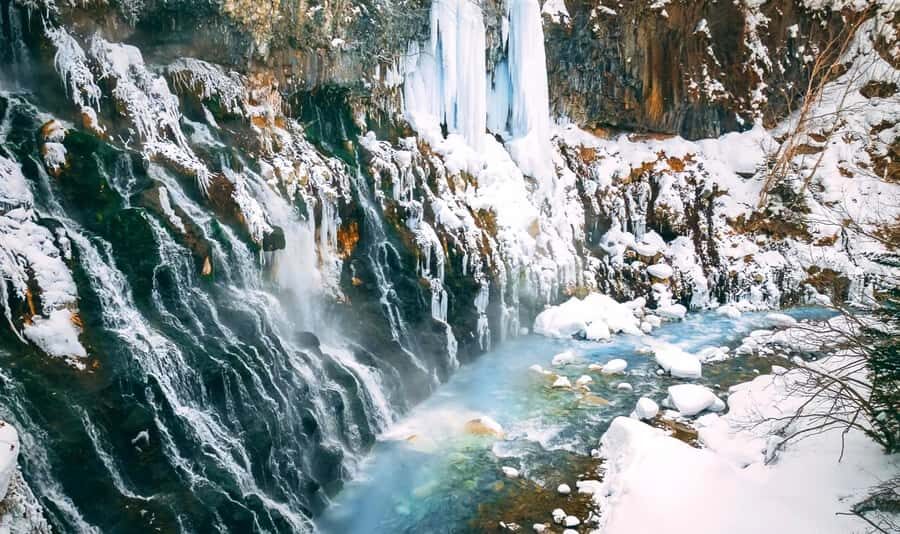 Sapporo:Asahiyama Zoo,Shirahige Waterfall&Blue Pond Day Trip - Visiting Shirahige Waterfall: Nature’s Cascading Art