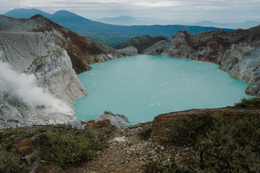 Ijen volcano crater view at dawn with sulfur smoke