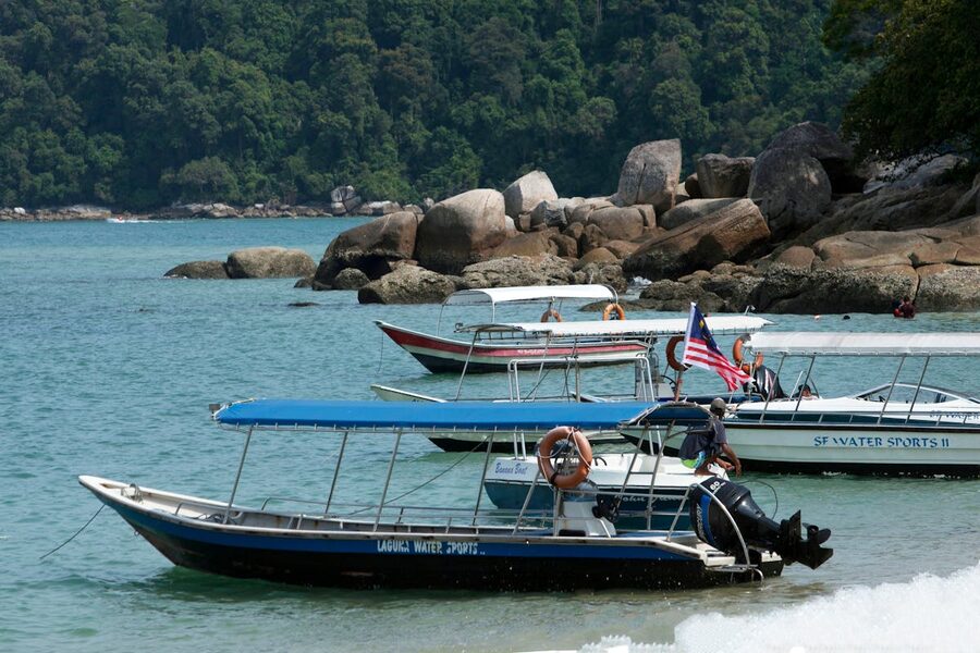 Small wooden boat in Malaysian tropical waters