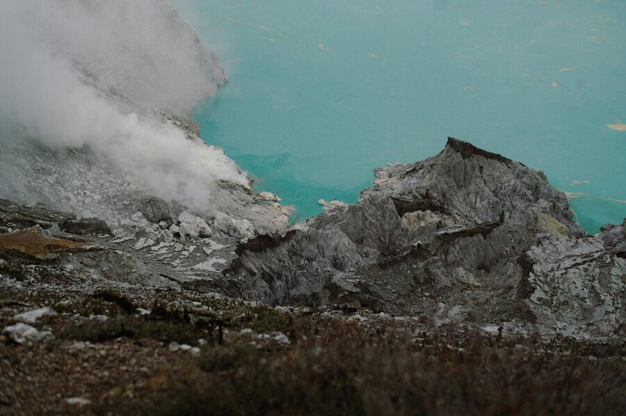 Hiker on the Ijen volcano rim trail