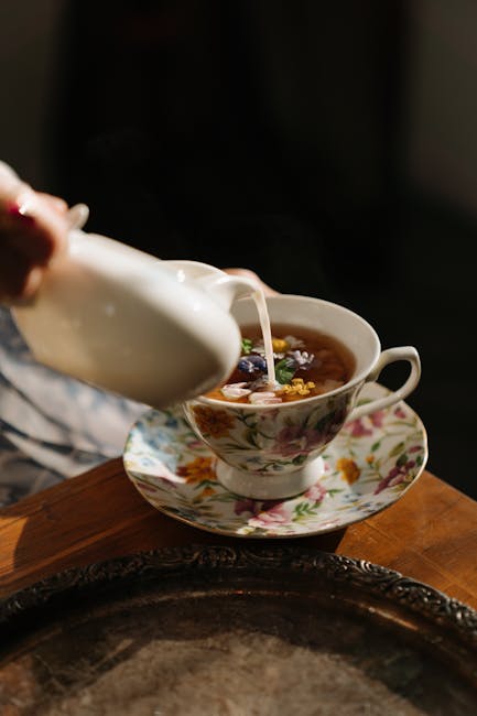 Tea being poured into a small cup