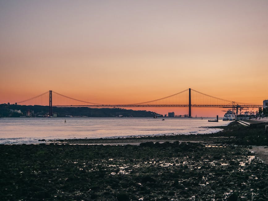 Sunset over the 25 de Abril Bridge in Lisbon