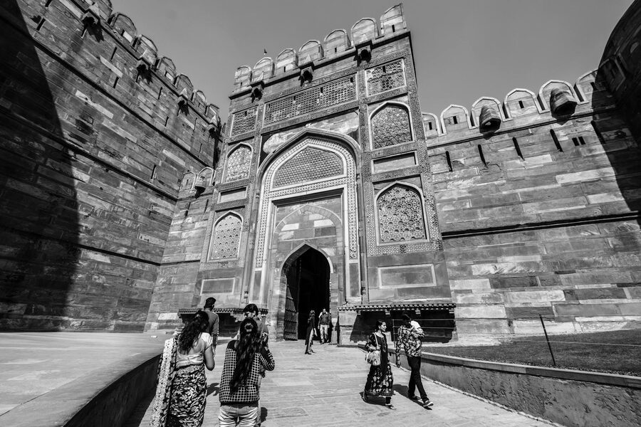 Visitors walking toward Agra Fort gateway