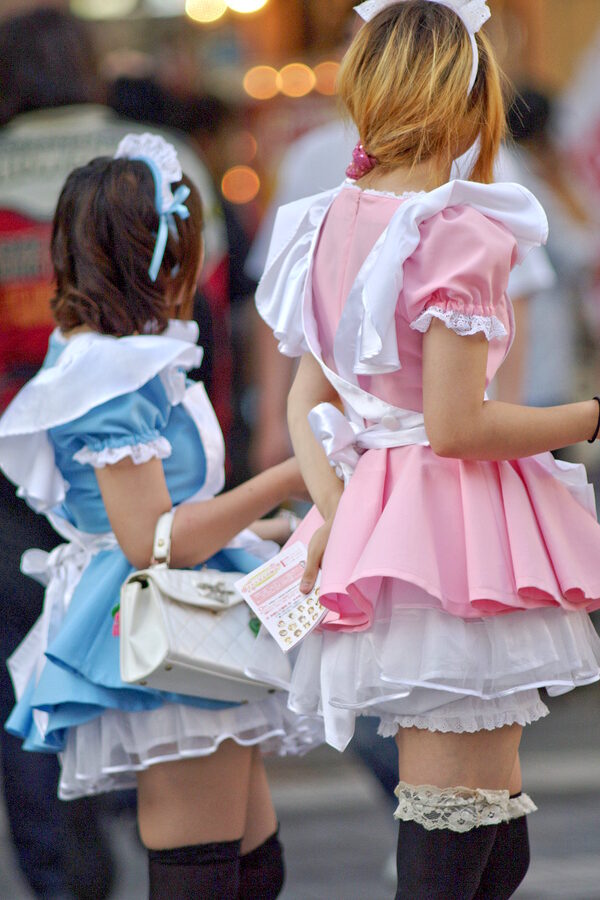 Maid cafe staff promoting outside store in Akihabara Tokyo