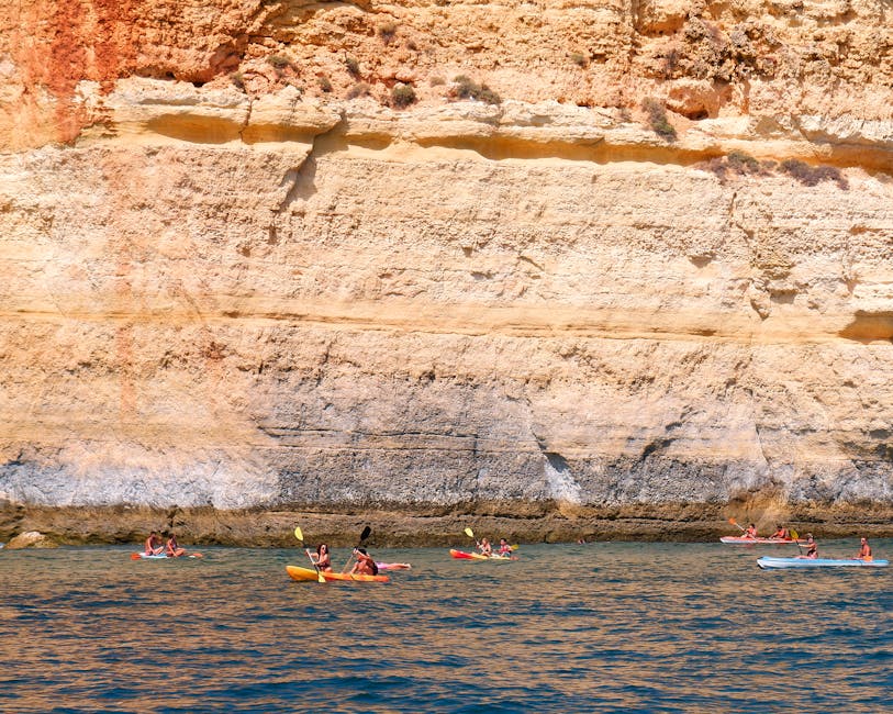 Kayaker paddling at Algarve cliffs near Benagil