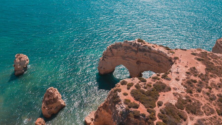 Marinha Beach double arch and cliffs from above, Algarve