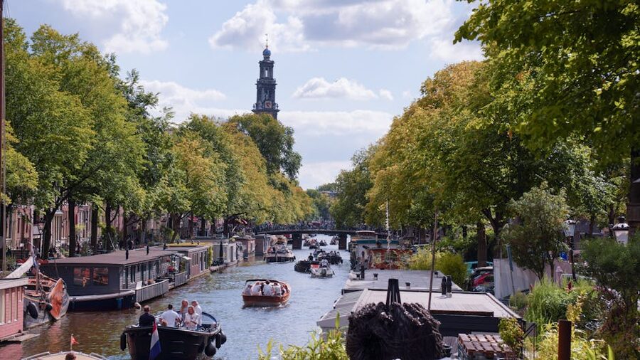 Amsterdam canal scene with Westerkerk and boats