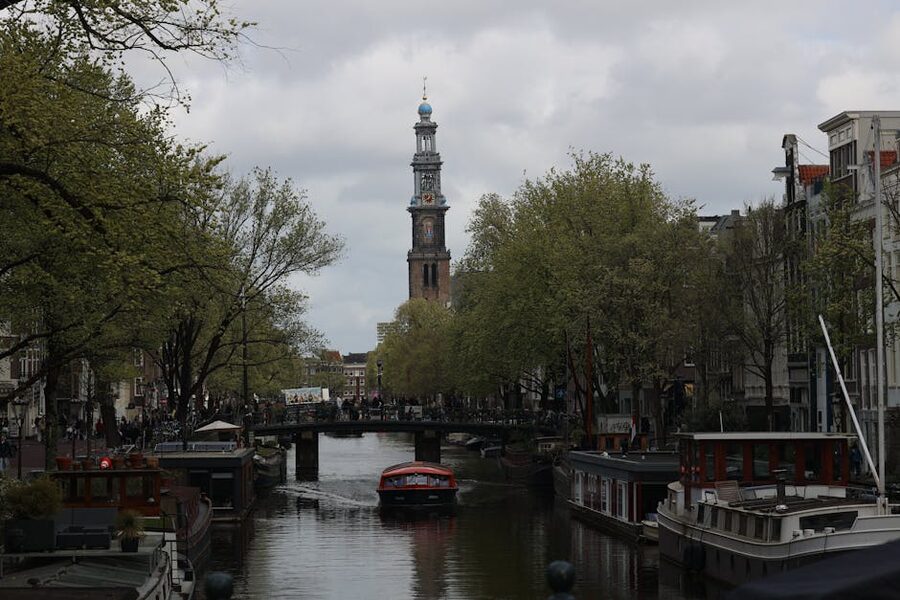 Westerkerk and Prinsengracht canal Amsterdam with tour boat