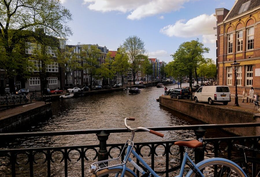 Blue bike on bridge over Amsterdam canal