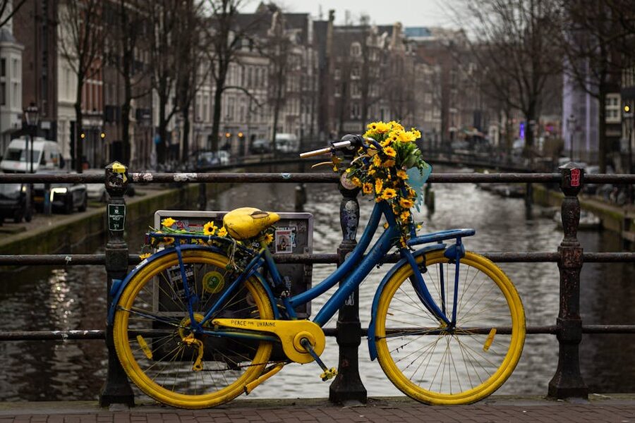 Decorated bicycle on canal bridge Amsterdam