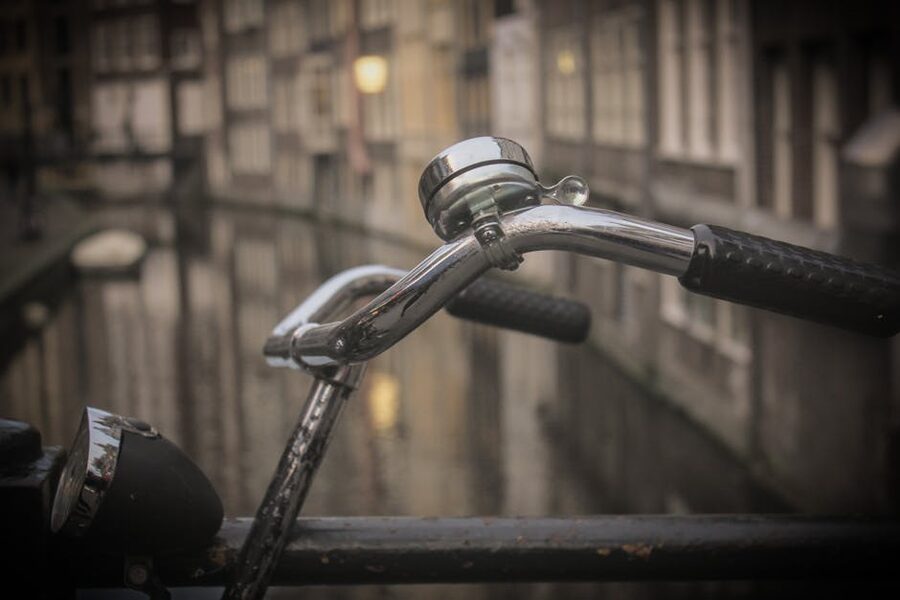 Vintage bicycle handlebars over Amsterdam canal
