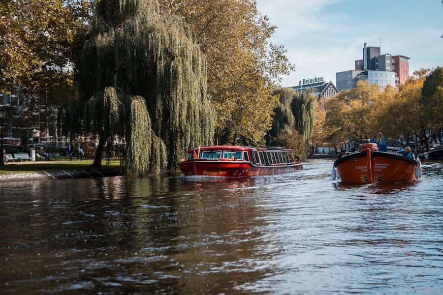 Amsterdam passenger canal boats traveling
