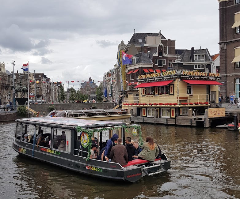 Amsterdam canal cruise passengers under glass roof