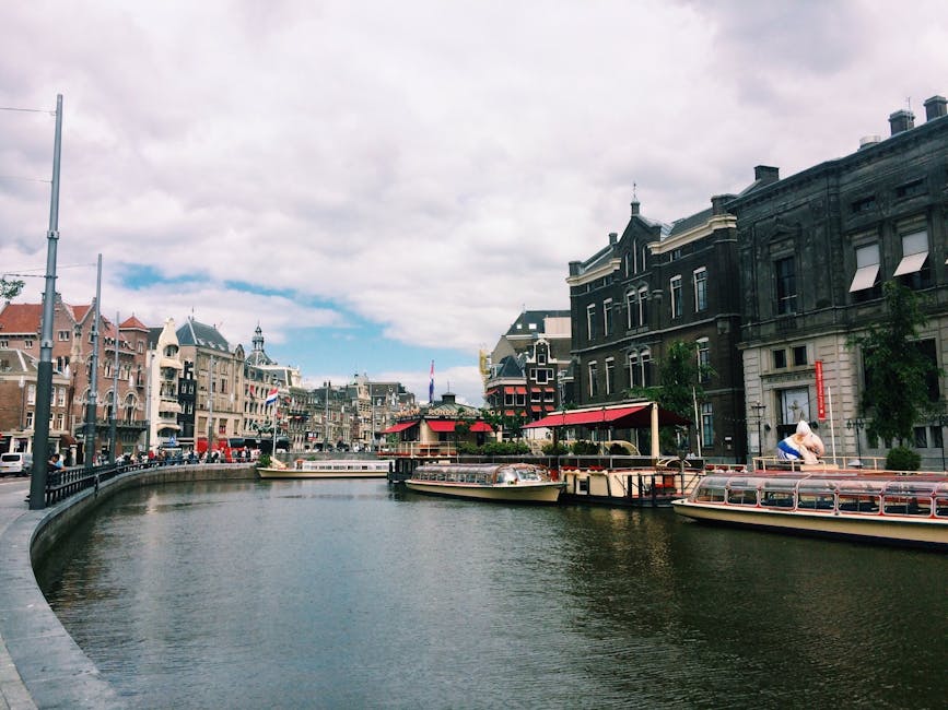 Amsterdam tour boats on canal river