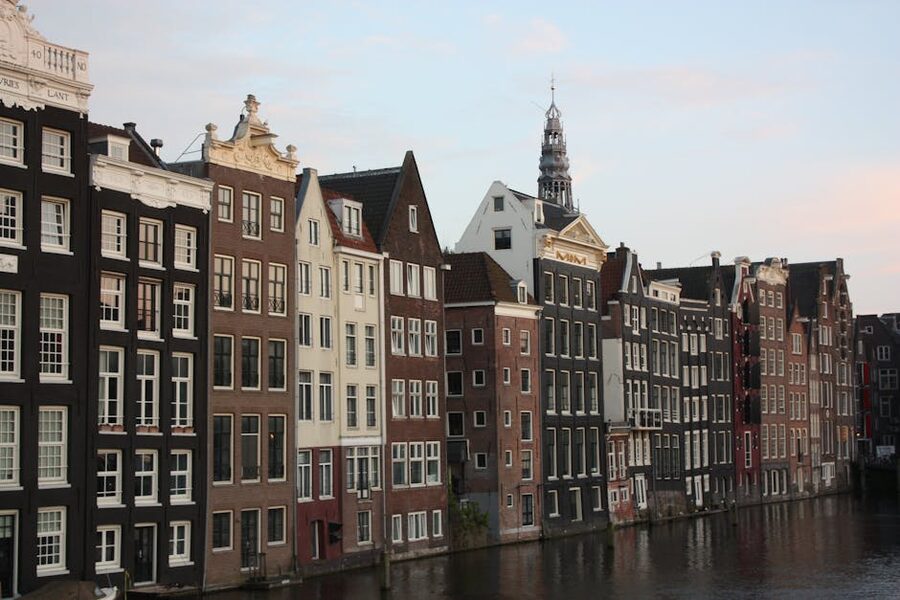 Amsterdam canal houses reflected at sunset