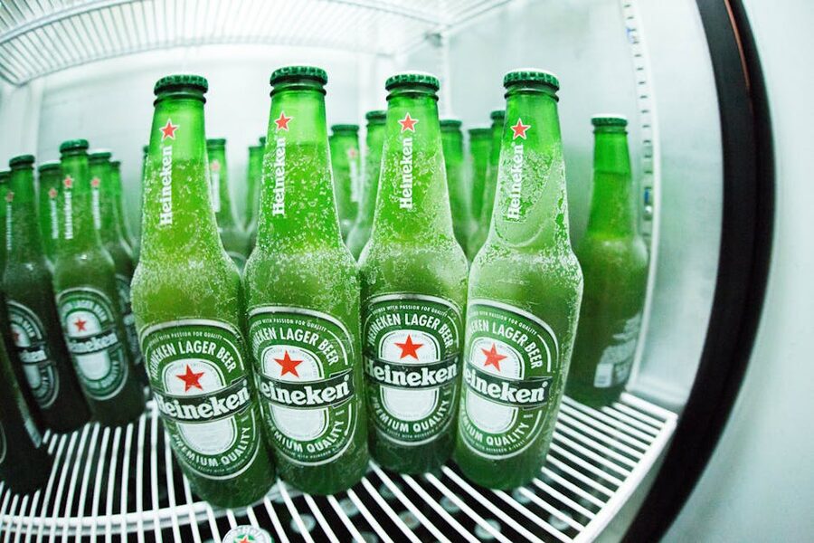 Cold green Heineken bottles in fridge