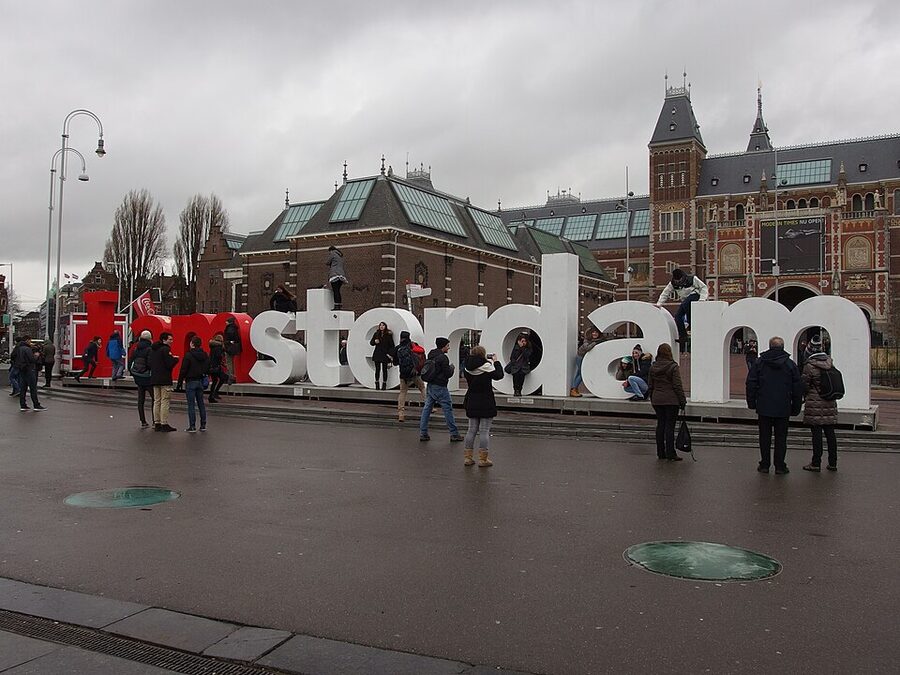 I amsterdam sign at Museumplein with Rijksmuseum behind