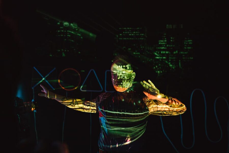 Person in projected cityscape at immersive art venue Amsterdam