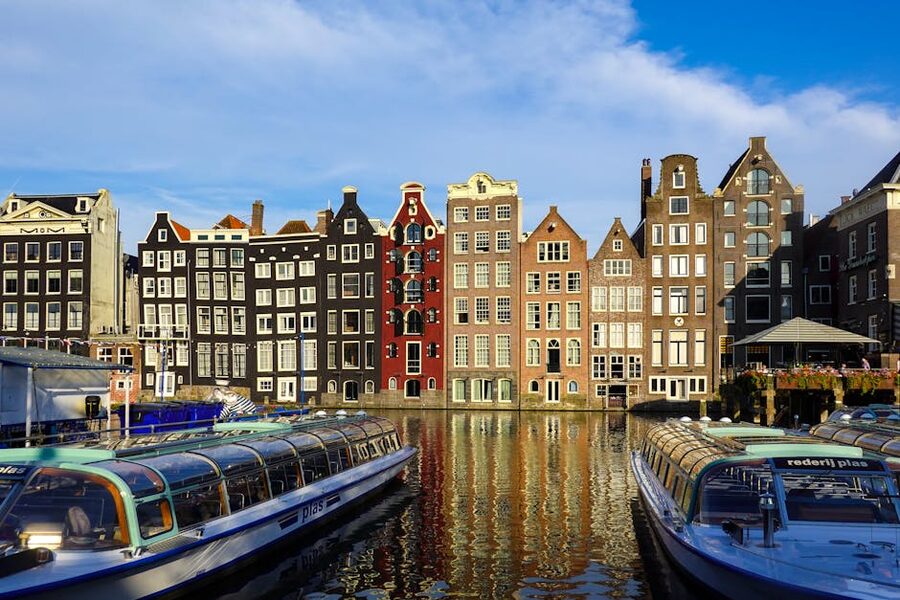 Amsterdam canal scene with historic Dutch buildings and boats