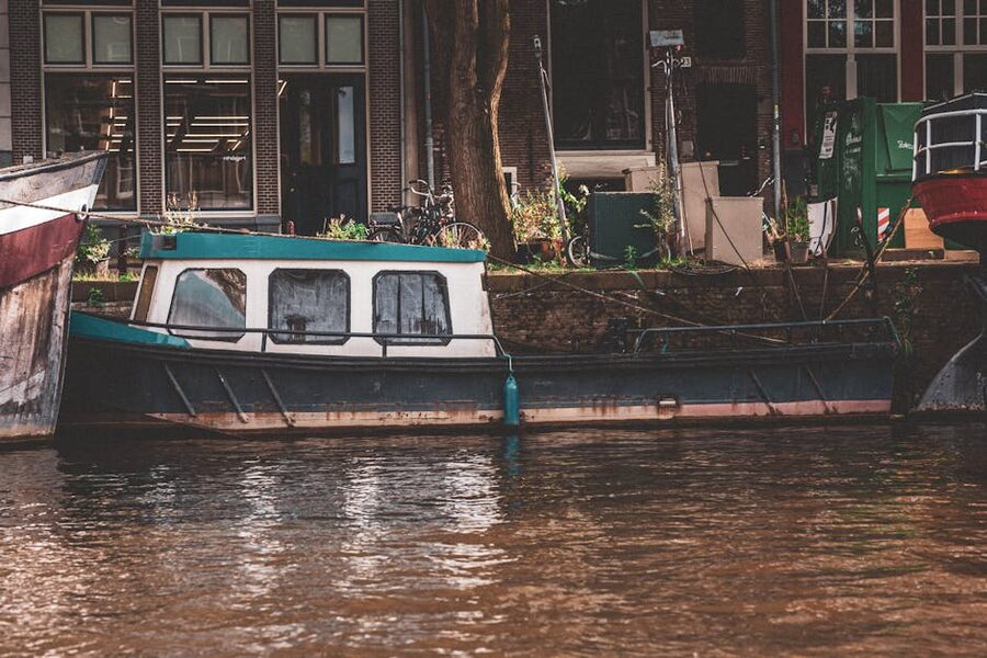 Rustic wooden boat on a quiet Amsterdam canal