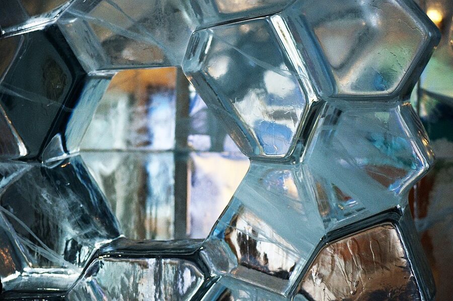 Carved ice walls and table inside a minus ten degree icebar