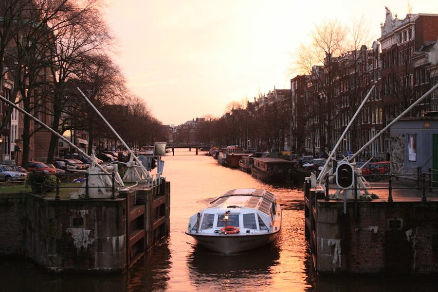 Open canal boat at sunset Amsterdam