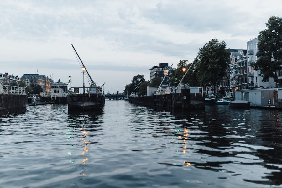 Amsterdam canal at evening with waterfront buildings
