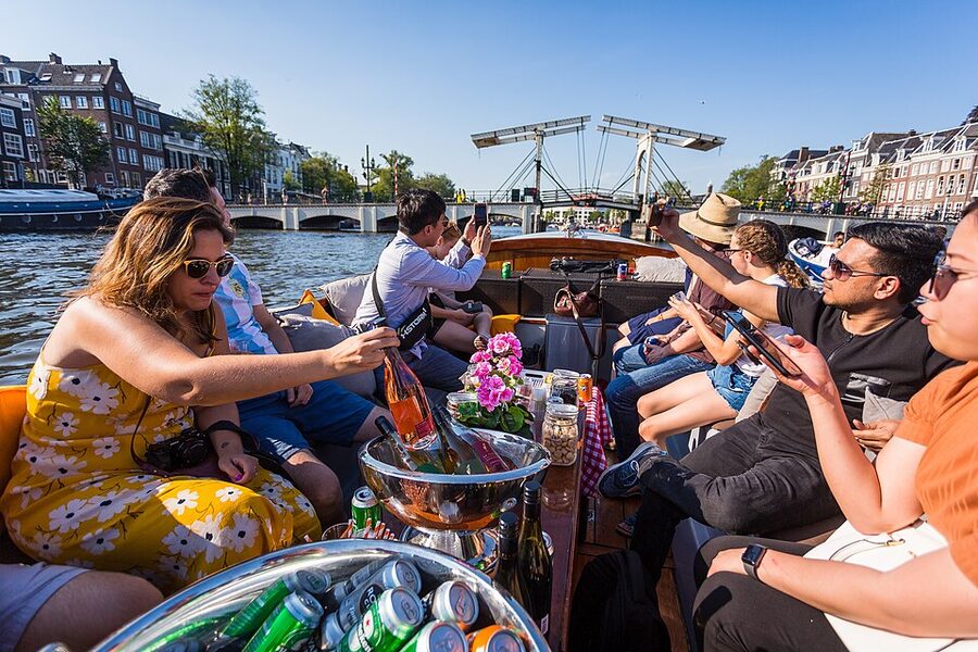 Small open sloep canal cruise boat in Amsterdam