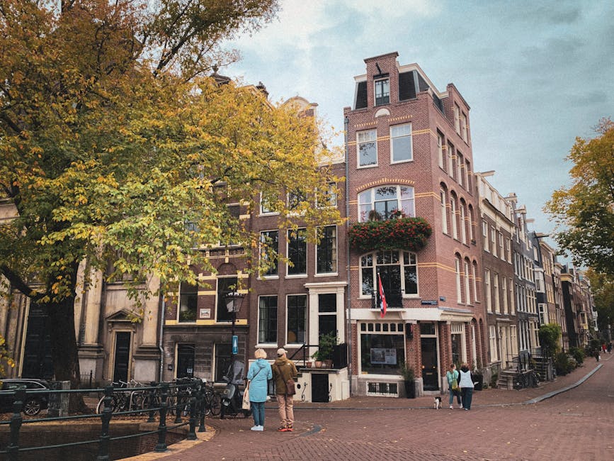 Amsterdam canal houses with autumn trees