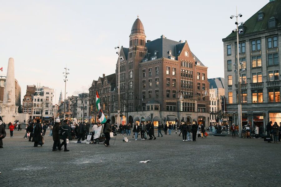 Dam Square Amsterdam at dusk with Royal Palace