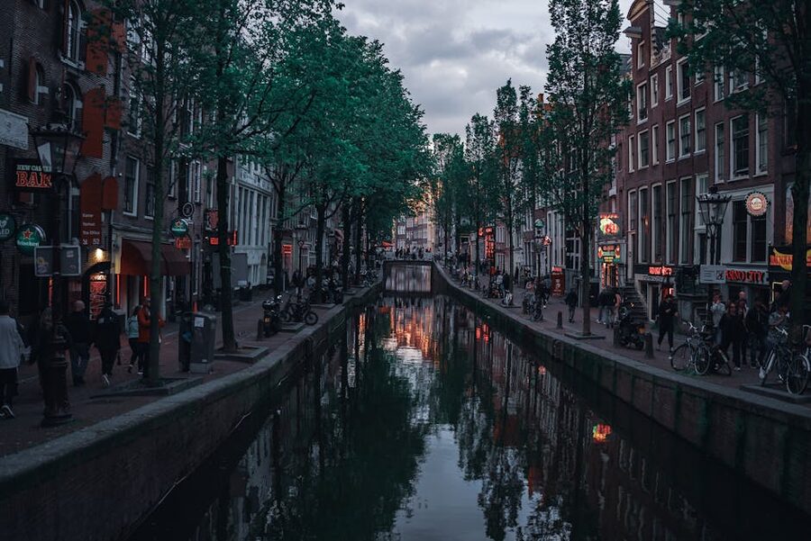 Amsterdam canal at twilight near Dam Square