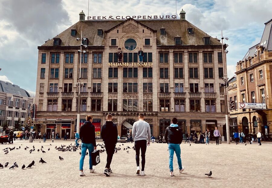 People walking past Madame Tussauds entrance on Dam Square Amsterdam