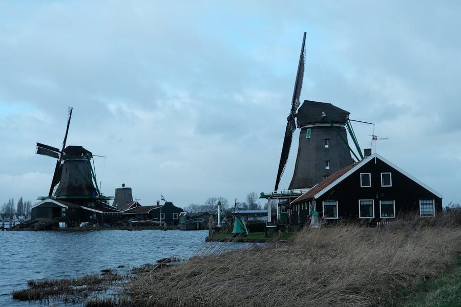 Zaanse Schans windmills against a dramatic cloudy sky