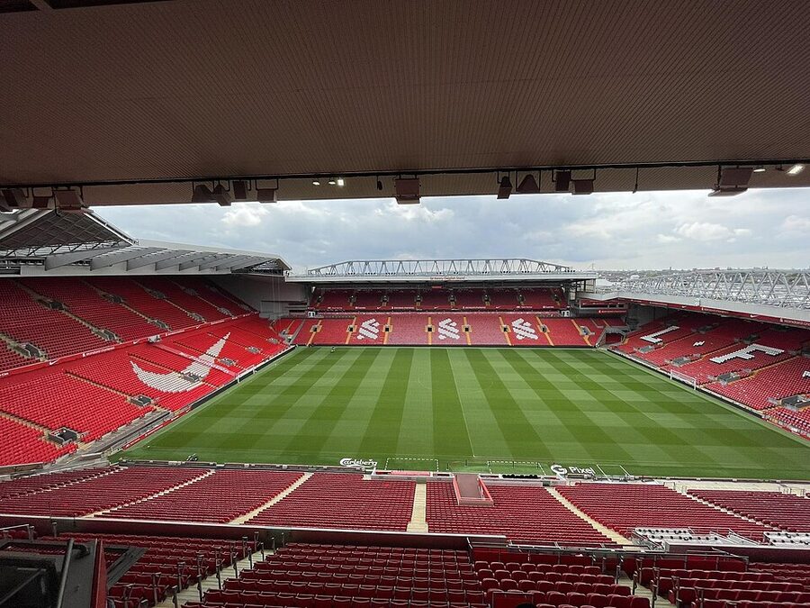 Anfield stadium exterior view with red signage and approach