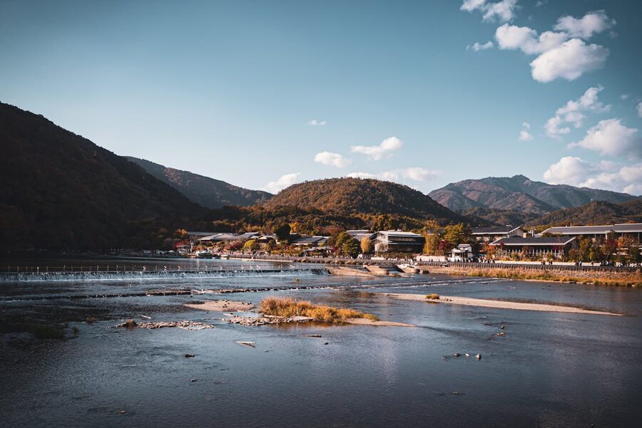 Blue sky over Arashiyama mountains and river in Kyoto Japan