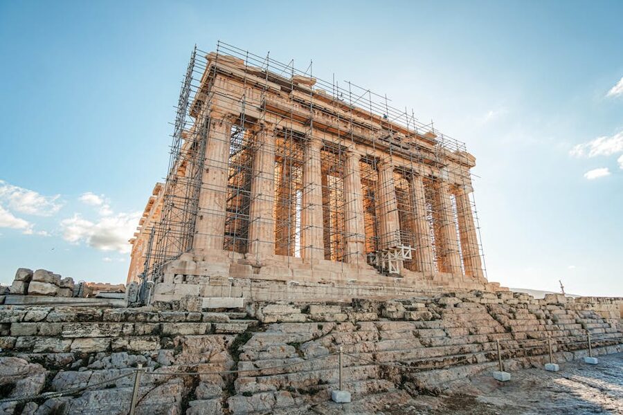 The Parthenon under restoration with scaffolding cranes Athens