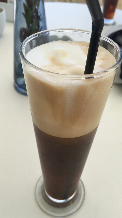 Greek frappe iced coffee in tall glass