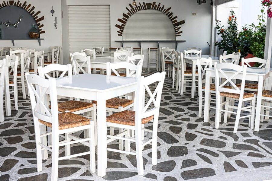Traditional Greek cafe with white chairs