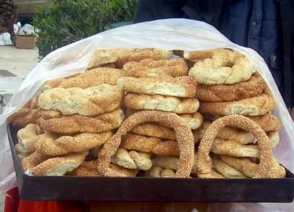 Koulouri sesame bread rings on a vendor cart