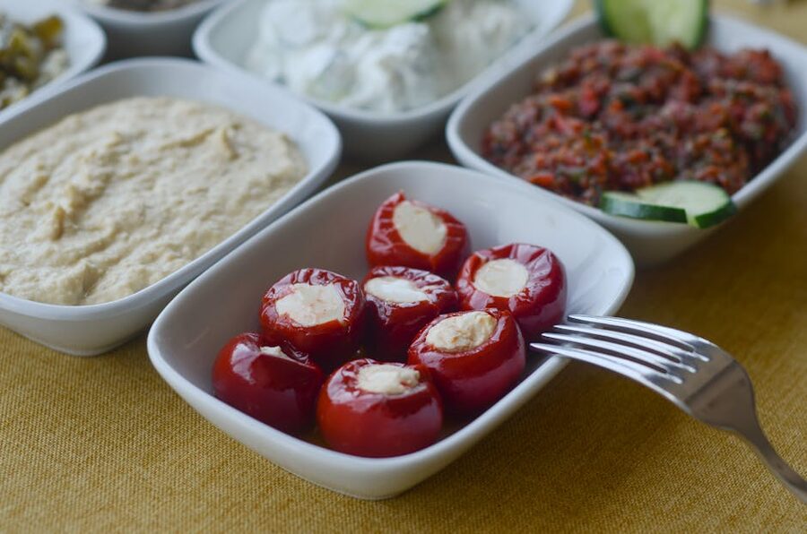 Mediterranean meze platter with dips and stuffed peppers