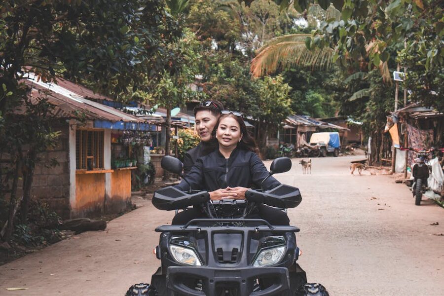 Quad bikes passing through a Balinese village on a countryside ATV ride