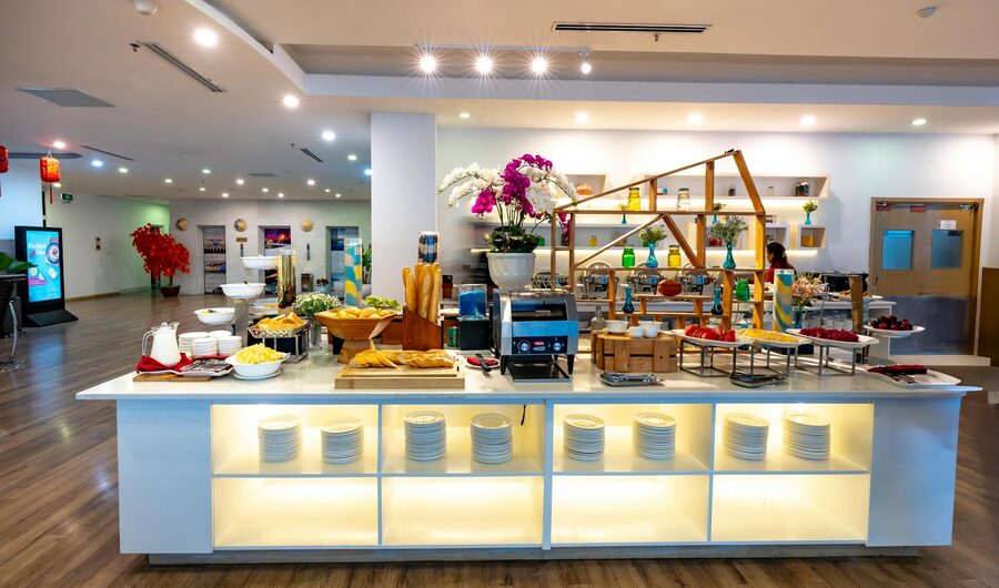 Luxurious indoor buffet table with diverse dishes and elegant decor