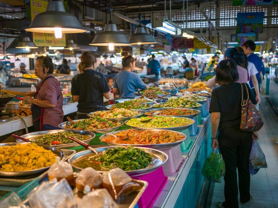 Bangkok street market with colorful Thai food stalls