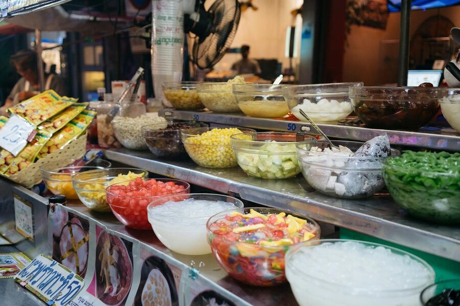 Colorful array of Thai desserts and sweets at Bangkok market stall